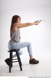 MOLLY SITTING POSE WITH GUN